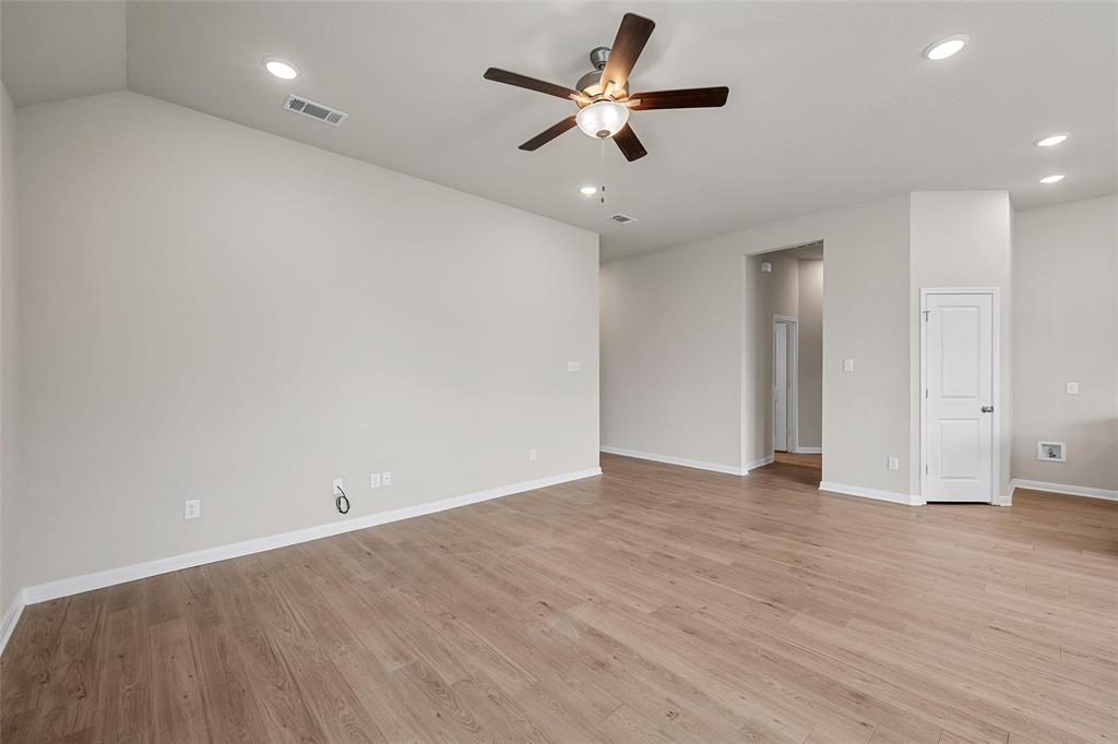 3224 Dottavio Road Lorena, TX 76655 - Photo 6 of 31 Spacious interior room featuring wood-finish flooring, vaulted ceiling, and recessed lighting