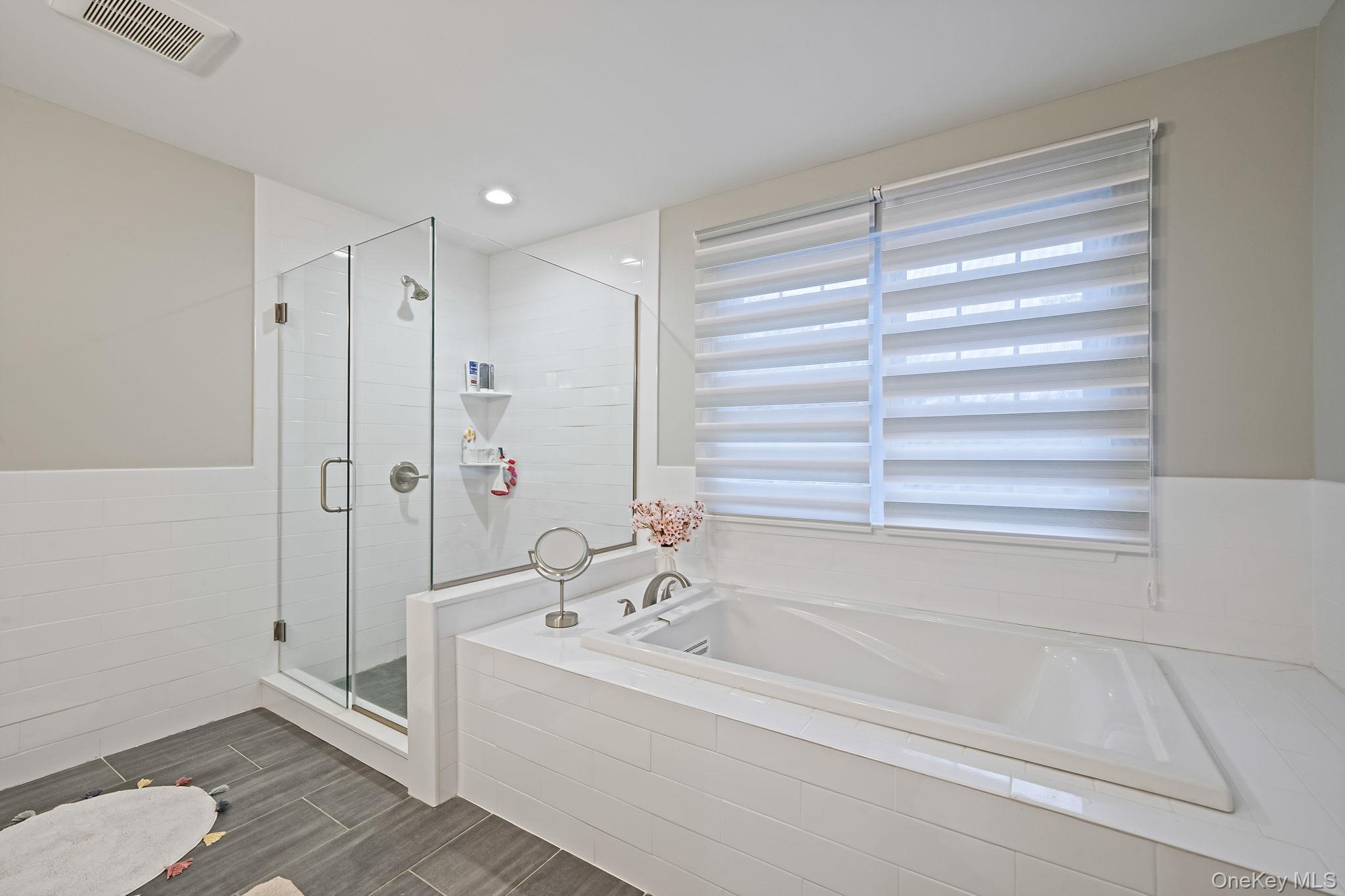 152 Wood Road Centereach, NY 11720 - Photo 21 of 35 a bathroom with a bathtub and a shower