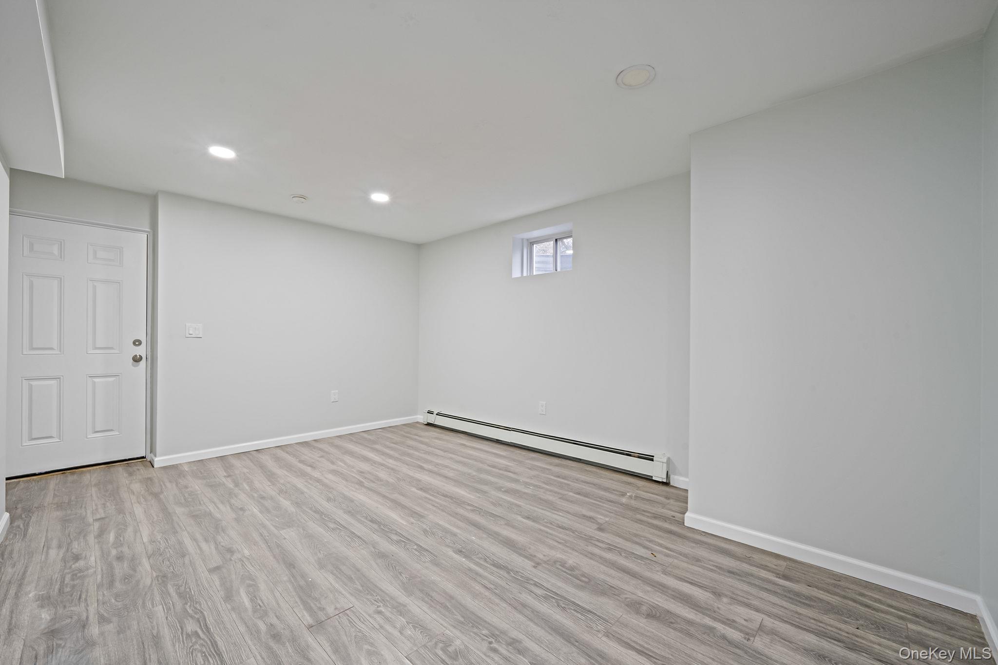 152 Wood Road Centereach, NY 11720 - Photo 34 of 35 a view of empty room with wooden floor