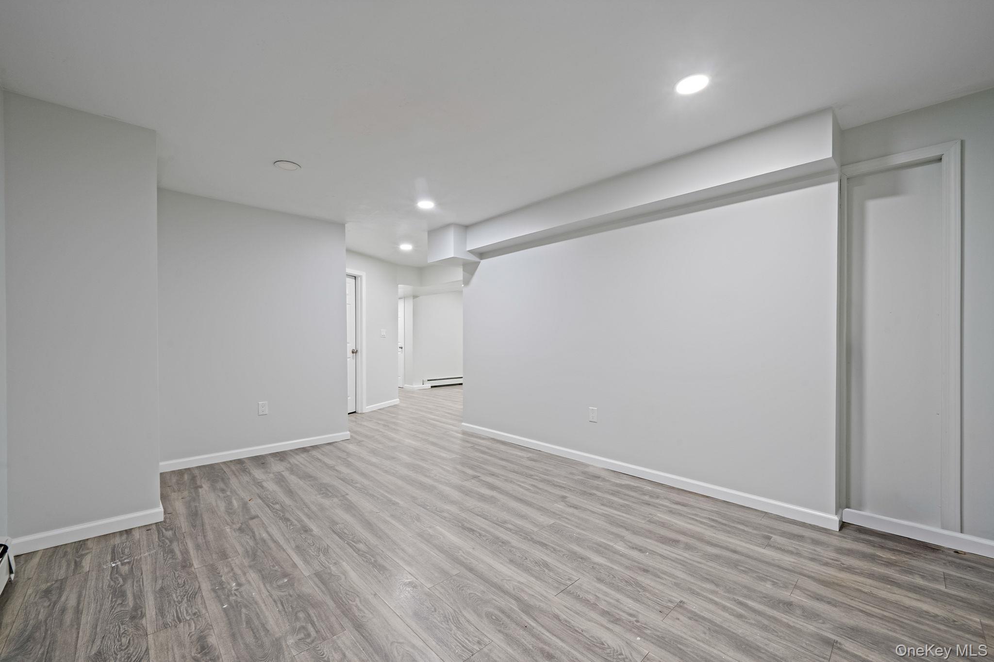 152 Wood Road Centereach, NY 11720 - Photo 35 of 35 a view of an empty room with wooden floor