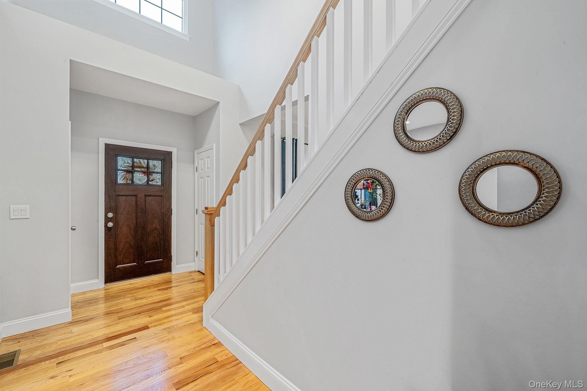 152 Wood Road Centereach, NY 11720 - Photo 5 of 35 a view of an entryway with wooden floor