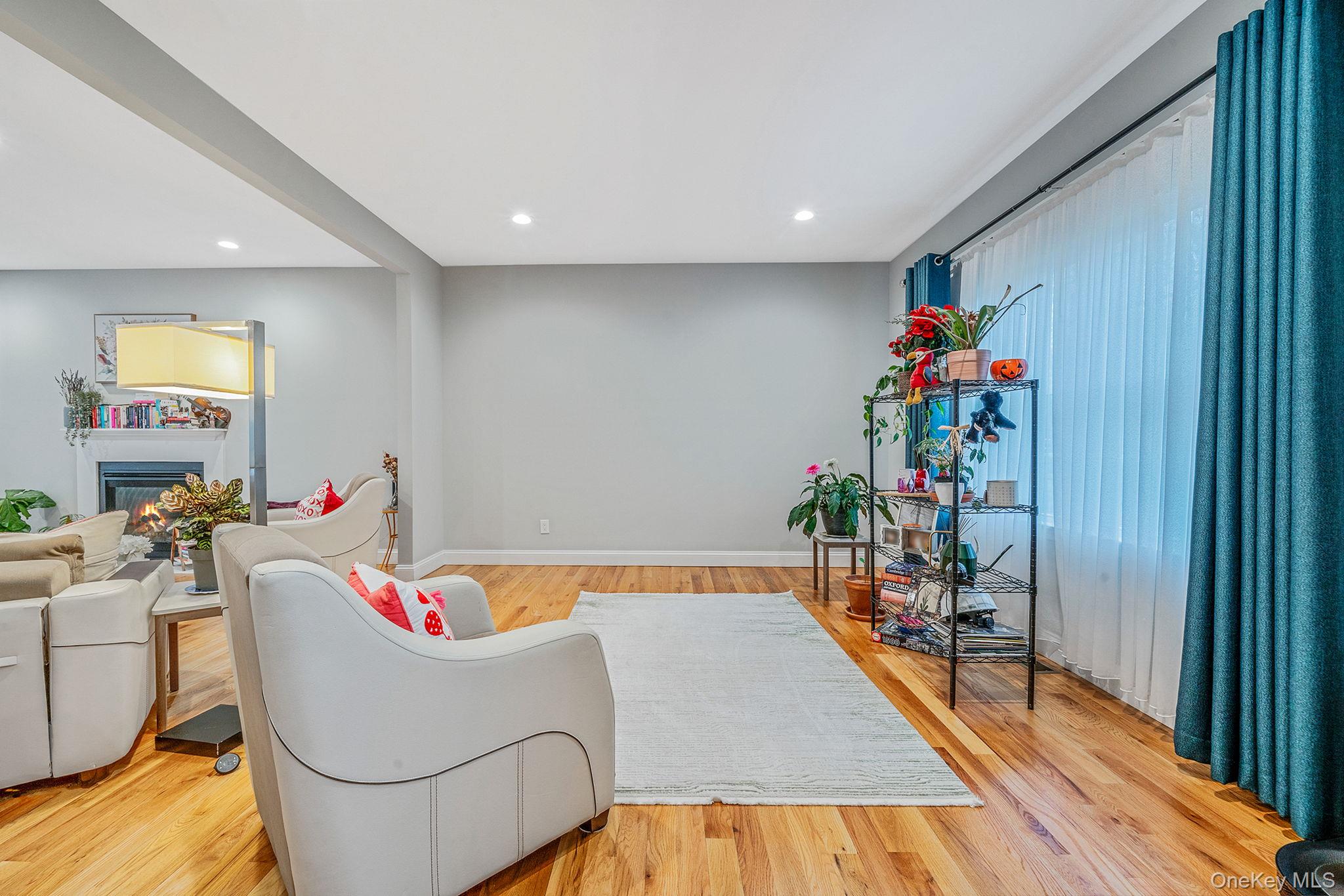 152 Wood Road Centereach, NY 11720 - Photo 6 of 35 a living room with furniture and a wooden floor