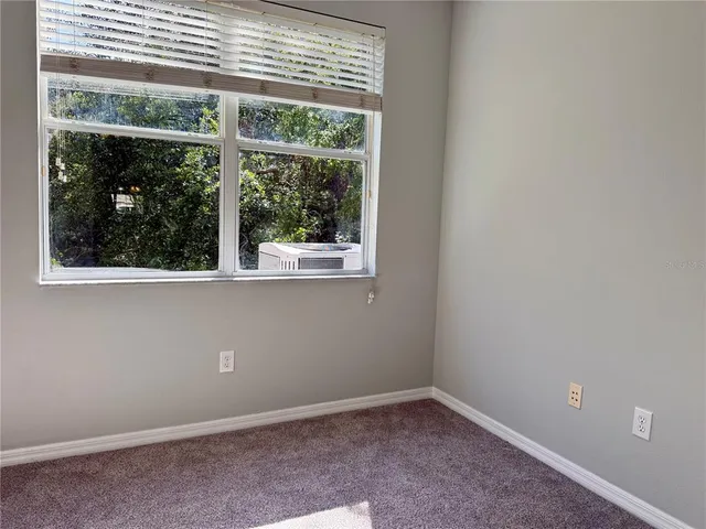 a view of a room with a large window