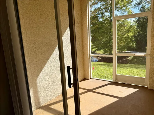 a view of a yard with a tree