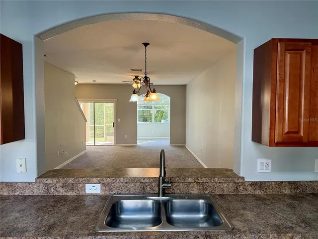 a kitchen with sink and window
