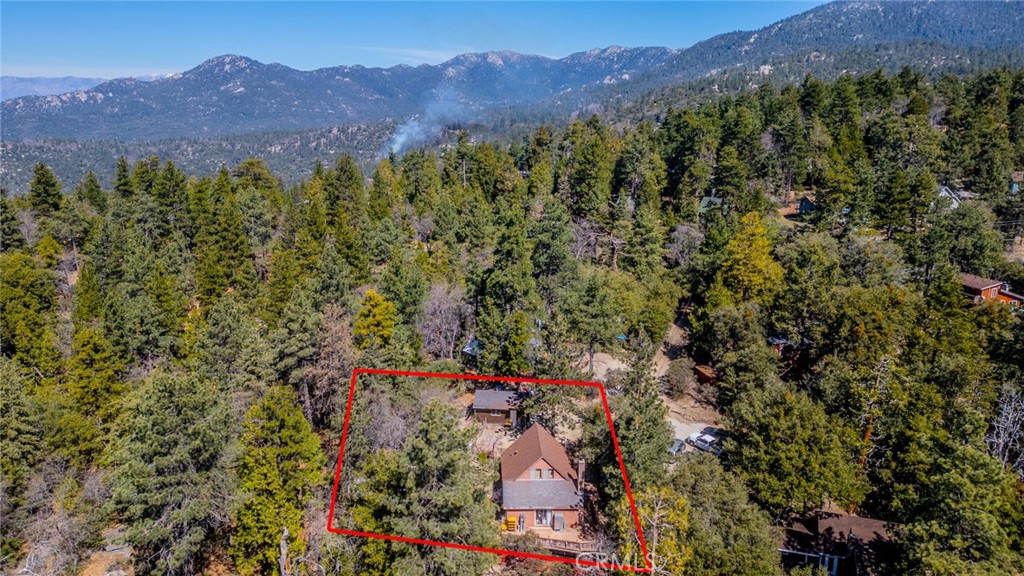 52647 Pine Cove Road Idyllwild, CA 92549 - Photo 32 of 35 a view of a lush green hillside and a building