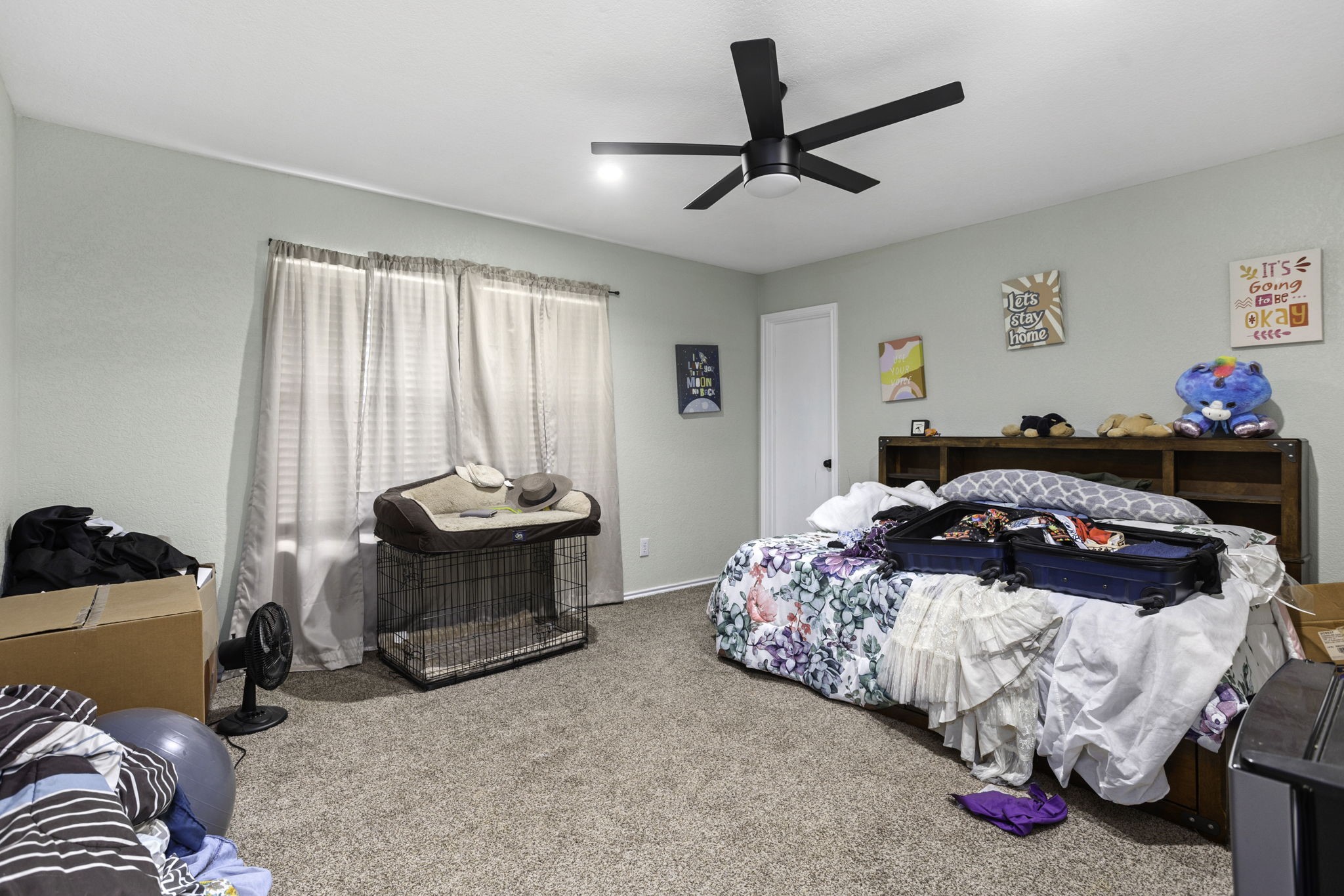 4518 Rothberger Way San Antonio, TX 78244 - Photo 14 of 18 a bedroom with bed and a chandelier