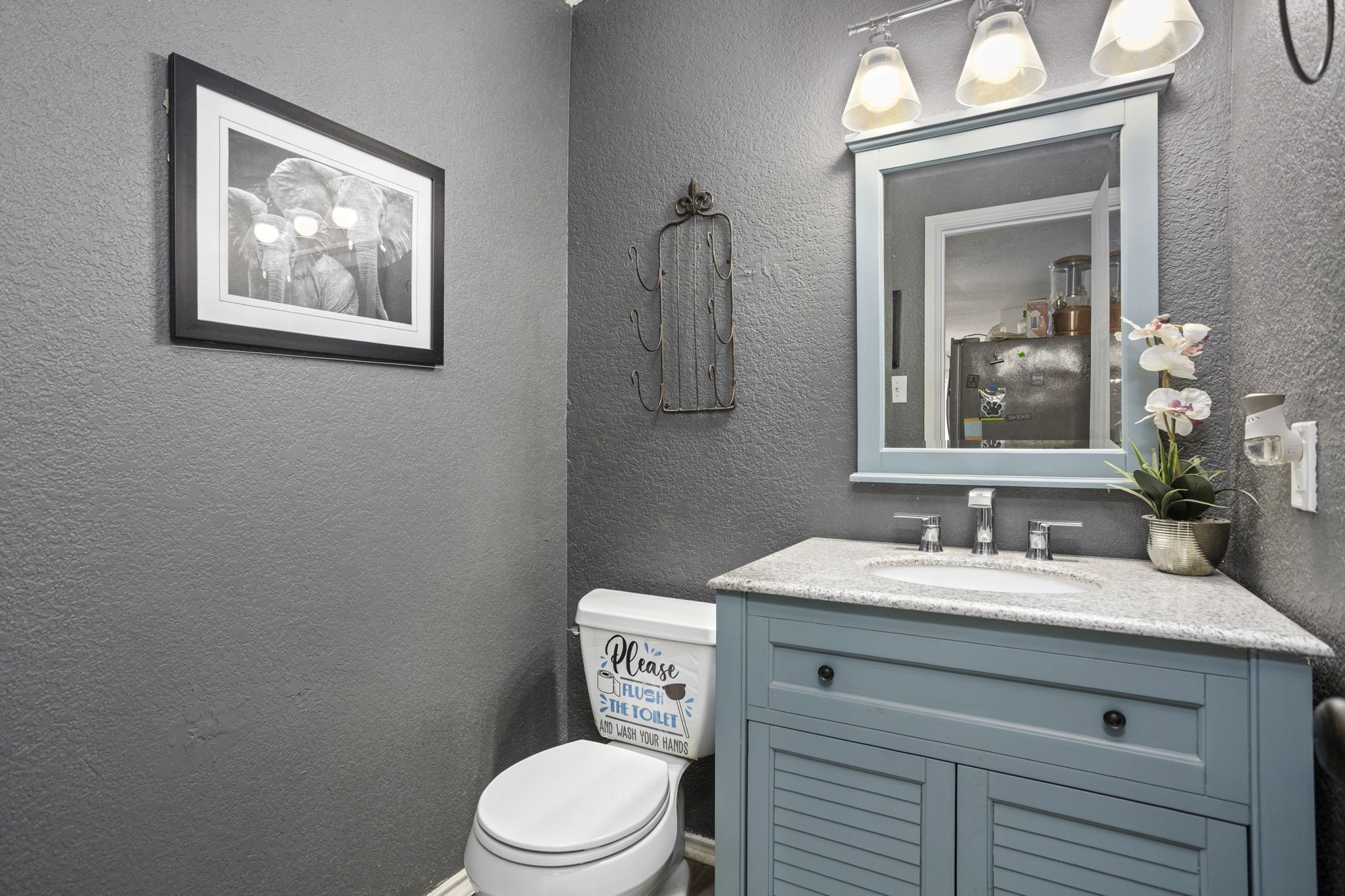 4518 Rothberger Way San Antonio, TX 78244 - Photo 16 of 18 a bathroom with a toilet sink and mirror