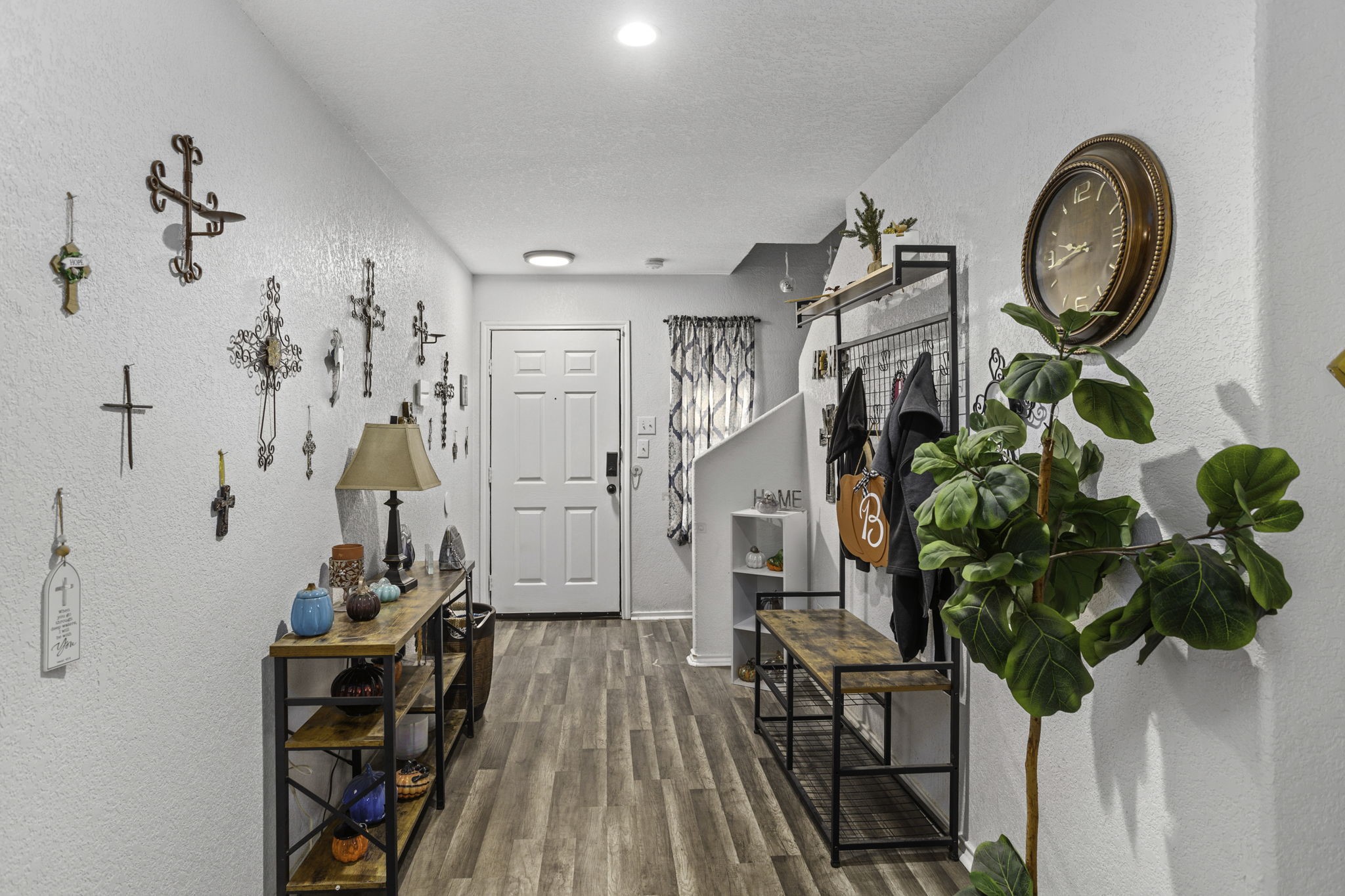 4518 Rothberger Way San Antonio, TX 78244 - Photo 2 of 18 a view of a hallway with wooden floor and a potted plant