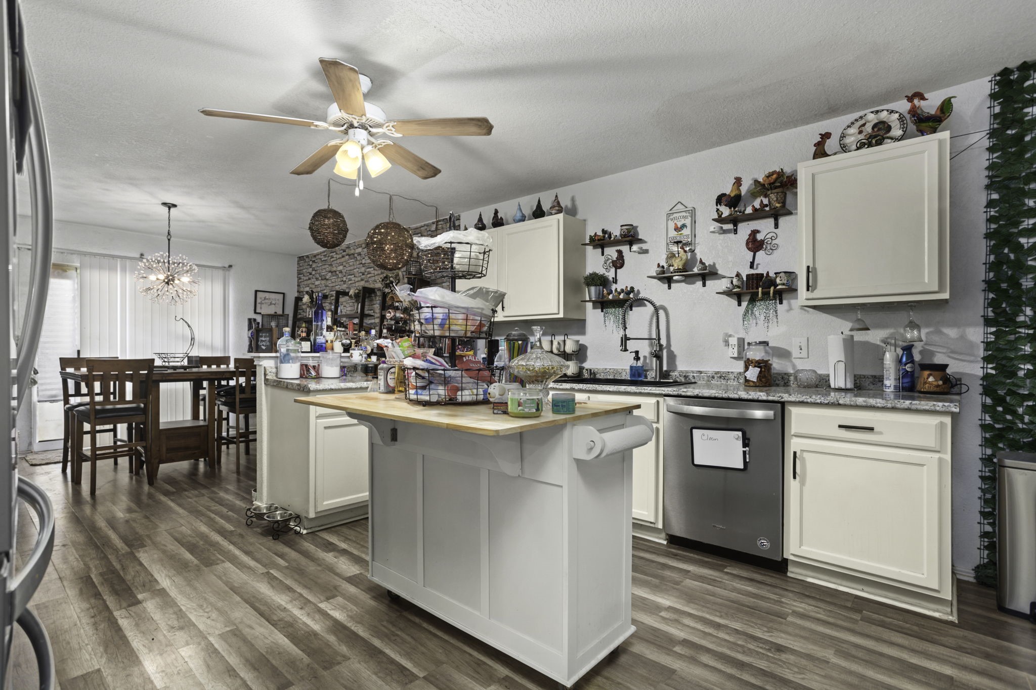 4518 Rothberger Way San Antonio, TX 78244 - Photo 9 of 18 a kitchen with white cabinets and sink
