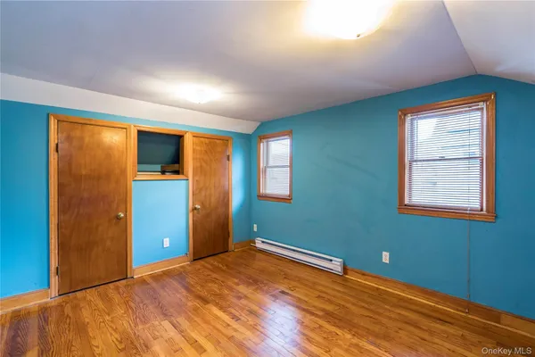 an empty room with closet area