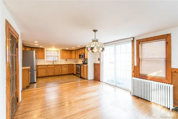 a view of a kitchen with a sink and a window