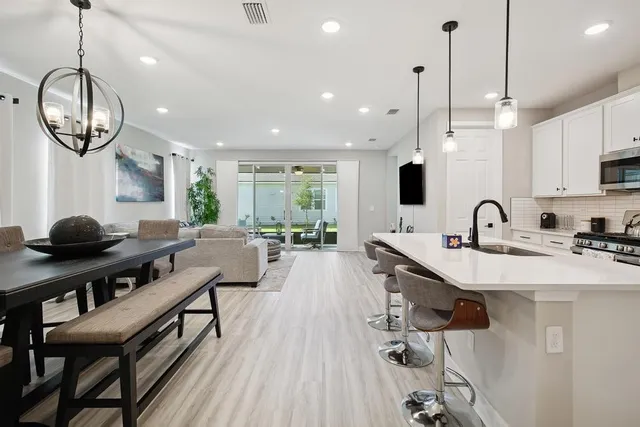 a very nice looking kitchen with a large window and stainless steel appliances