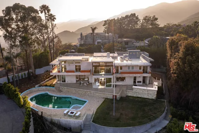 a terrace with outdoor seating and city view