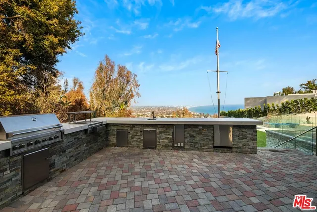 a view of a garden with a building in the background