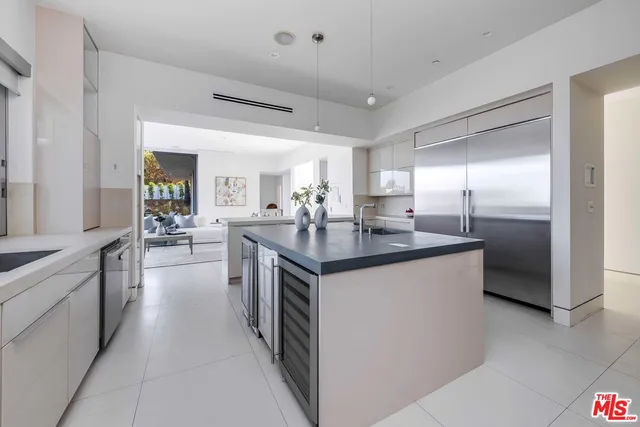 a kitchen with cabinets appliances and a sink