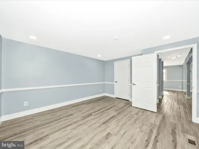 a view of a big room with windows