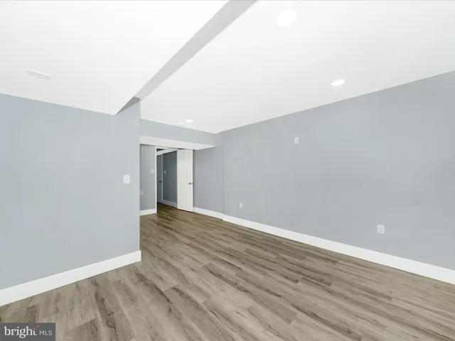 a kitchen with granite countertop white cabinets and stainless steel appliances