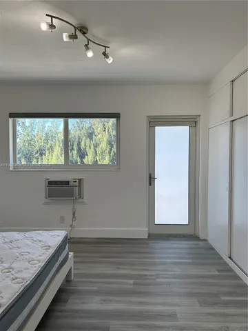 a bathroom with a sink and a window