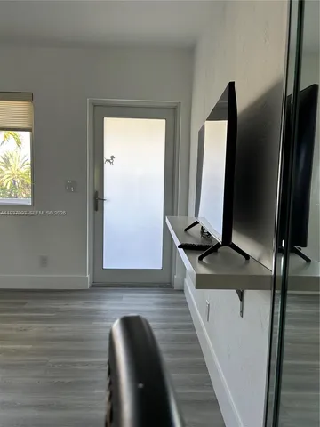 a view of a living room with a flat screen tv