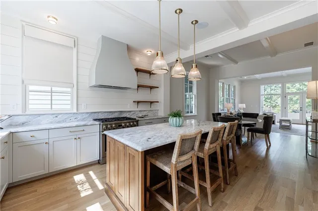 a kitchen with counter top space a sink appliances and cabinets