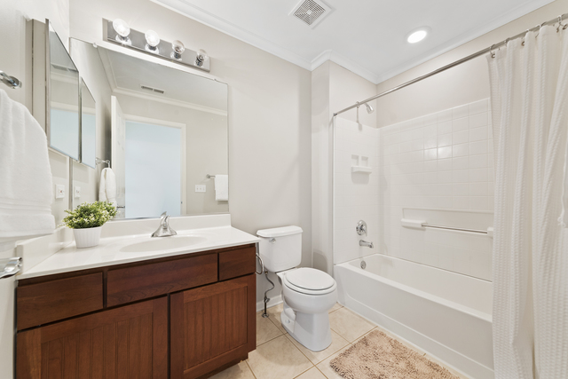 522 Telluride Court Bartlett, IL 60103 - Photo 12 of 18 a bathroom with a sink a toilet and shower