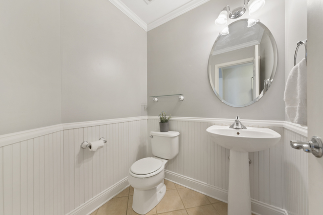 522 Telluride Court Bartlett, IL 60103 - Photo 3 of 18 a bathroom with a sink mirror and toilet