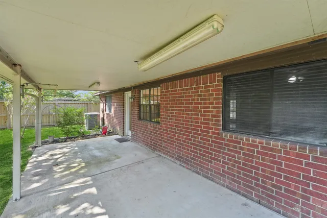 a front view of a house with yard and green space