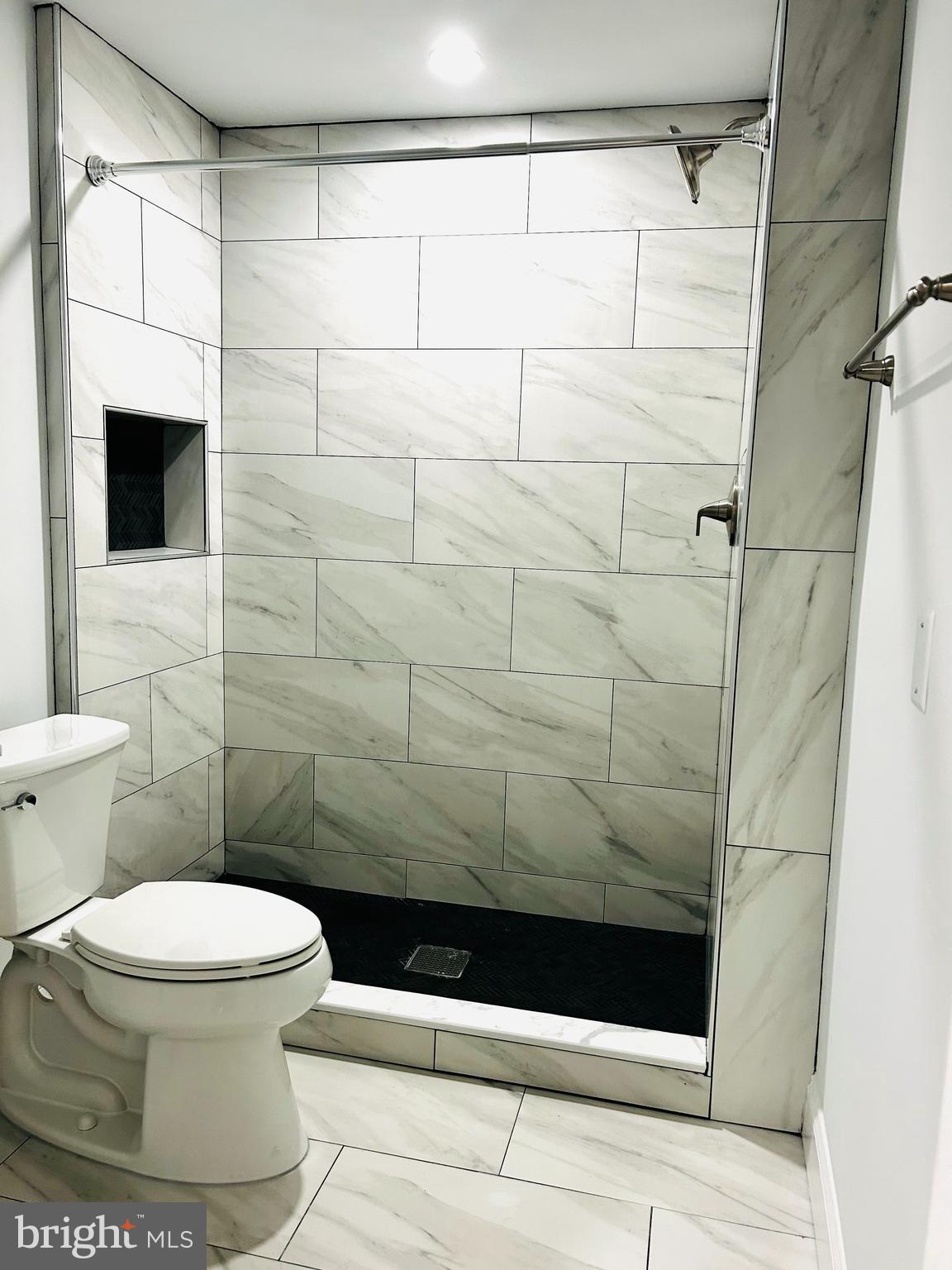 1724 18th Street Northwest, Unit 1 Washington, DC 20009 - Photo 8 of 11 a bathroom with a toilet and a shower