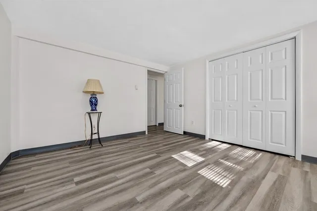 a view of a livingroom with wooden floor