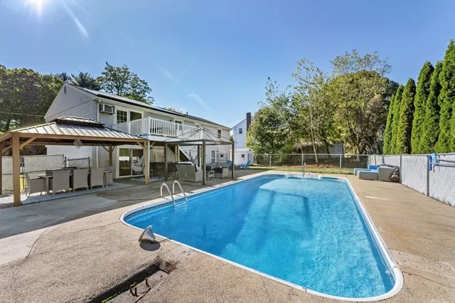 a view of a swimming pool with an outdoor seating