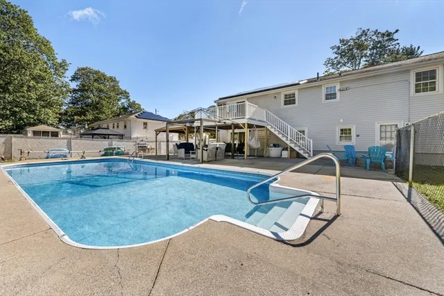 a view of a swimming pool with a patio