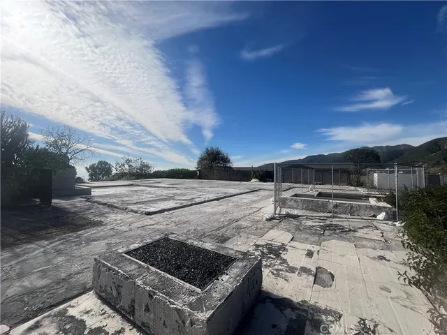 a view of a backyard with sitting area