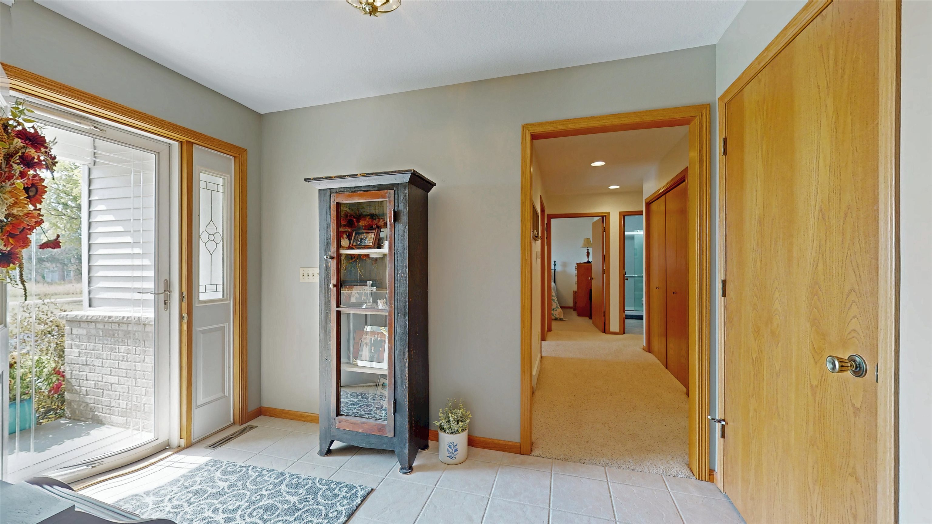 7821 Oakville Road Mount Carroll, IL 61053 - Photo 13 of 50 a view of a hallway with wooden floor and a bedroom