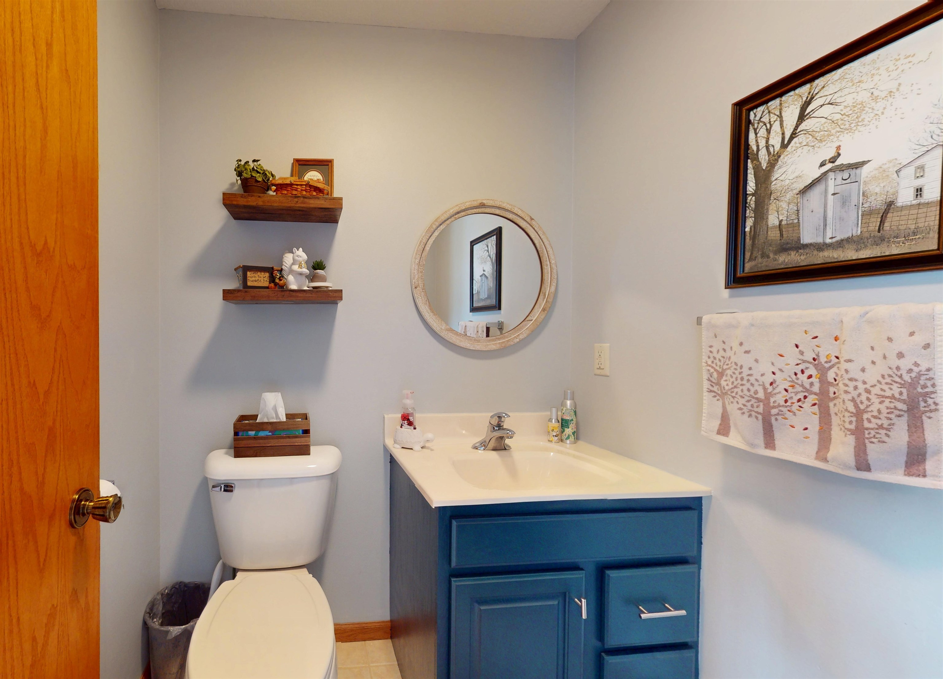 7821 Oakville Road Mount Carroll, IL 61053 - Photo 14 of 50 a bathroom with a toilet a sink and mirror