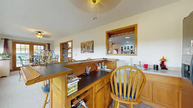 a living room with chairs and a table