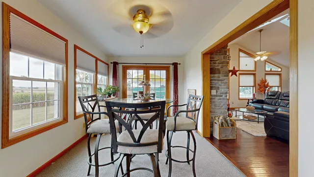 a view of a dining room with furniture window and wooden floor