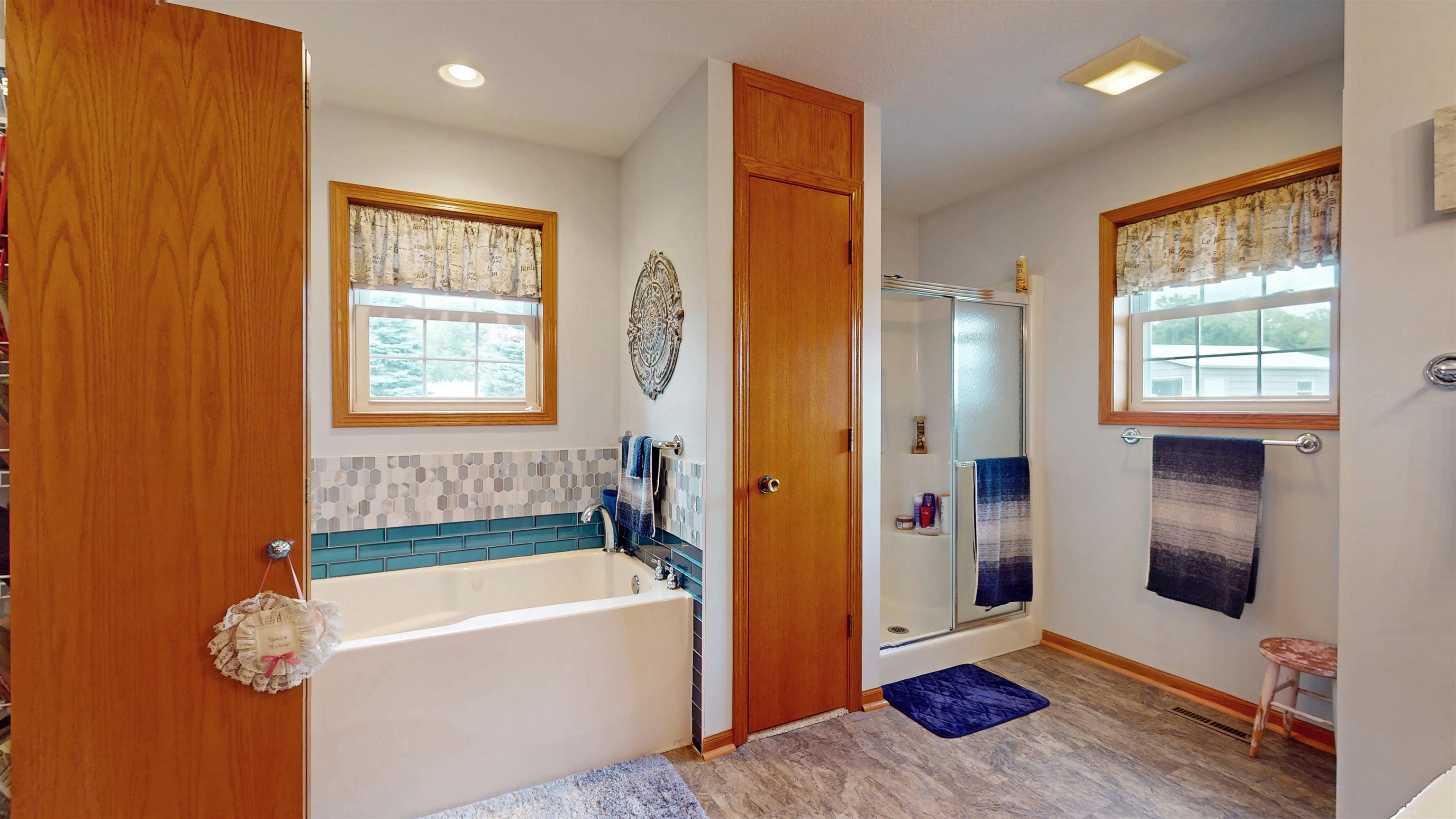 7821 Oakville Road Mount Carroll, IL 61053 - Photo 20 of 50 a bathroom with a tub sink shower and mirror