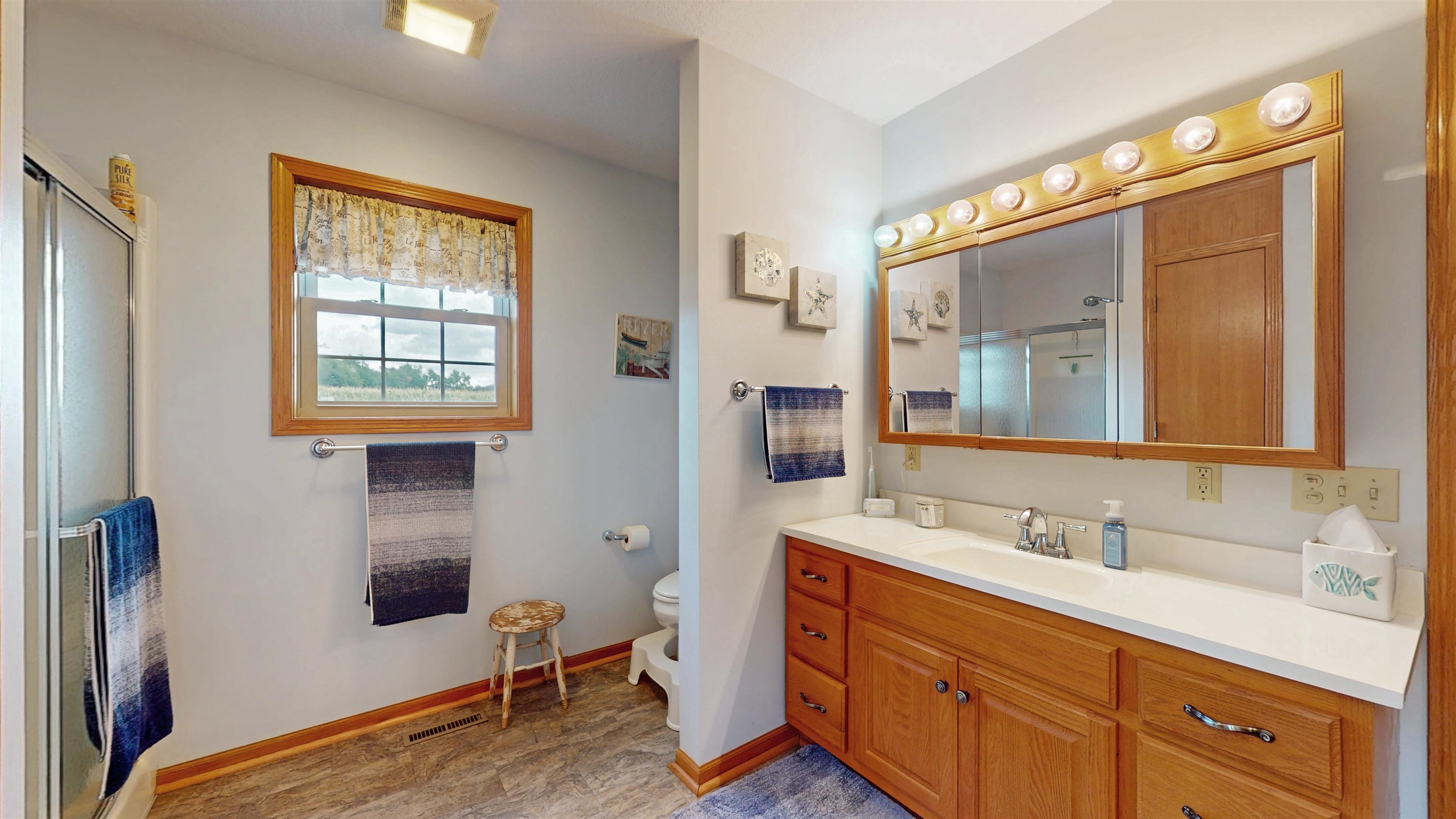 7821 Oakville Road Mount Carroll, IL 61053 - Photo 21 of 50 a bathroom with a sink double vanity and a mirror