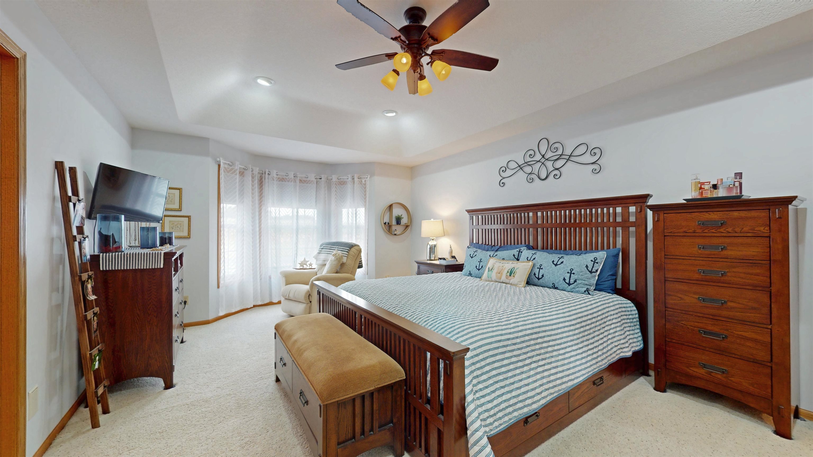 7821 Oakville Road Mount Carroll, IL 61053 - Photo 22 of 50 a bedroom with a bed and a chandelier