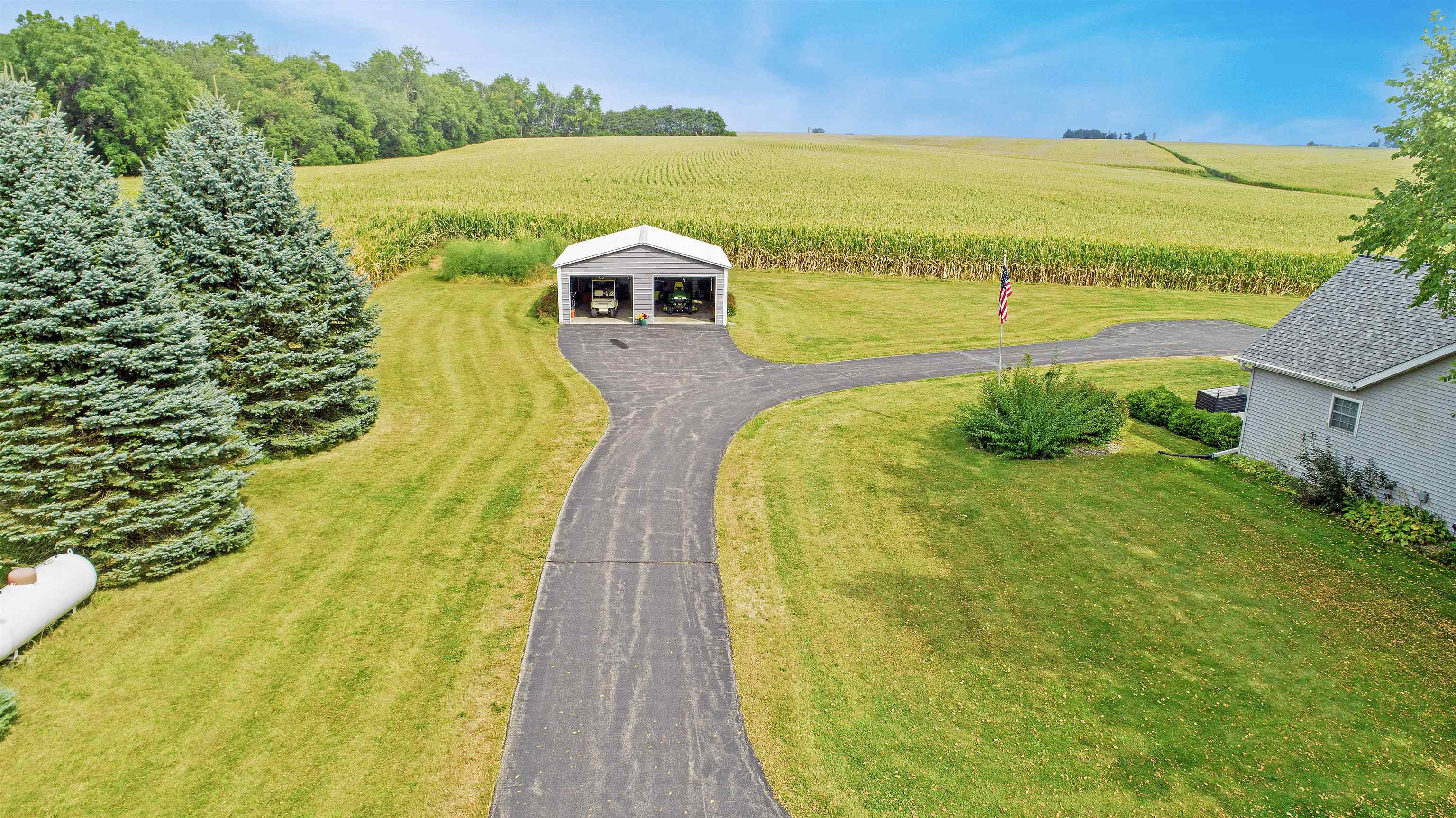 7821 Oakville Road Mount Carroll, IL 61053 - Photo 33 of 50 a view of a swimming pool with an outdoor space and seating area
