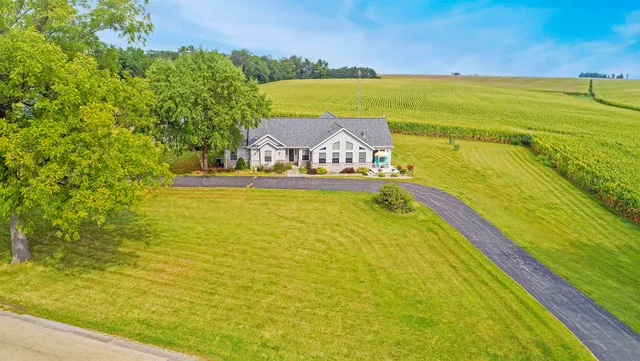 a view of a swimming pool with an outdoor space and seating area