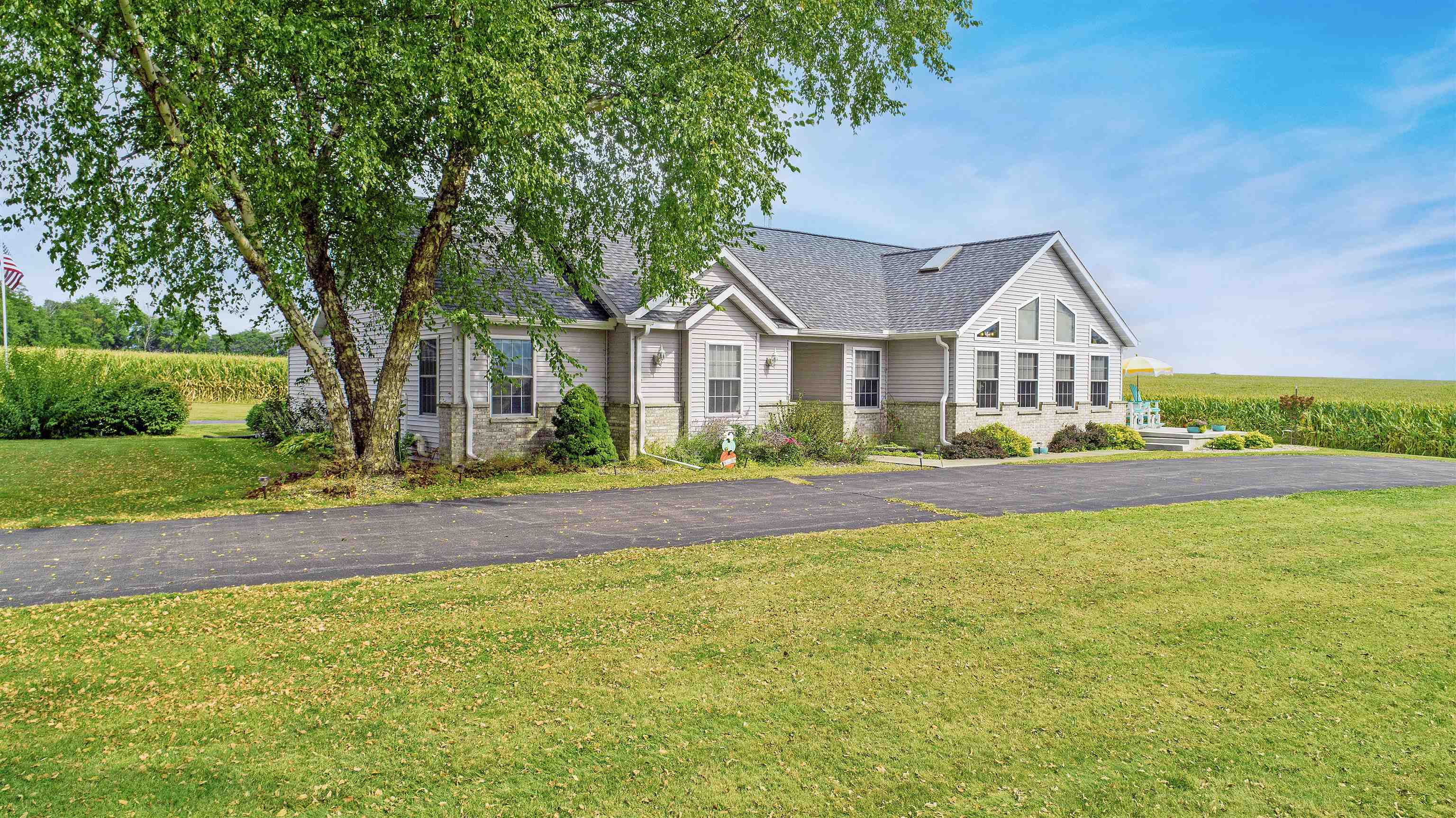 7821 Oakville Road Mount Carroll, IL 61053 - Photo 41 of 50 a front view of a house with a yard
