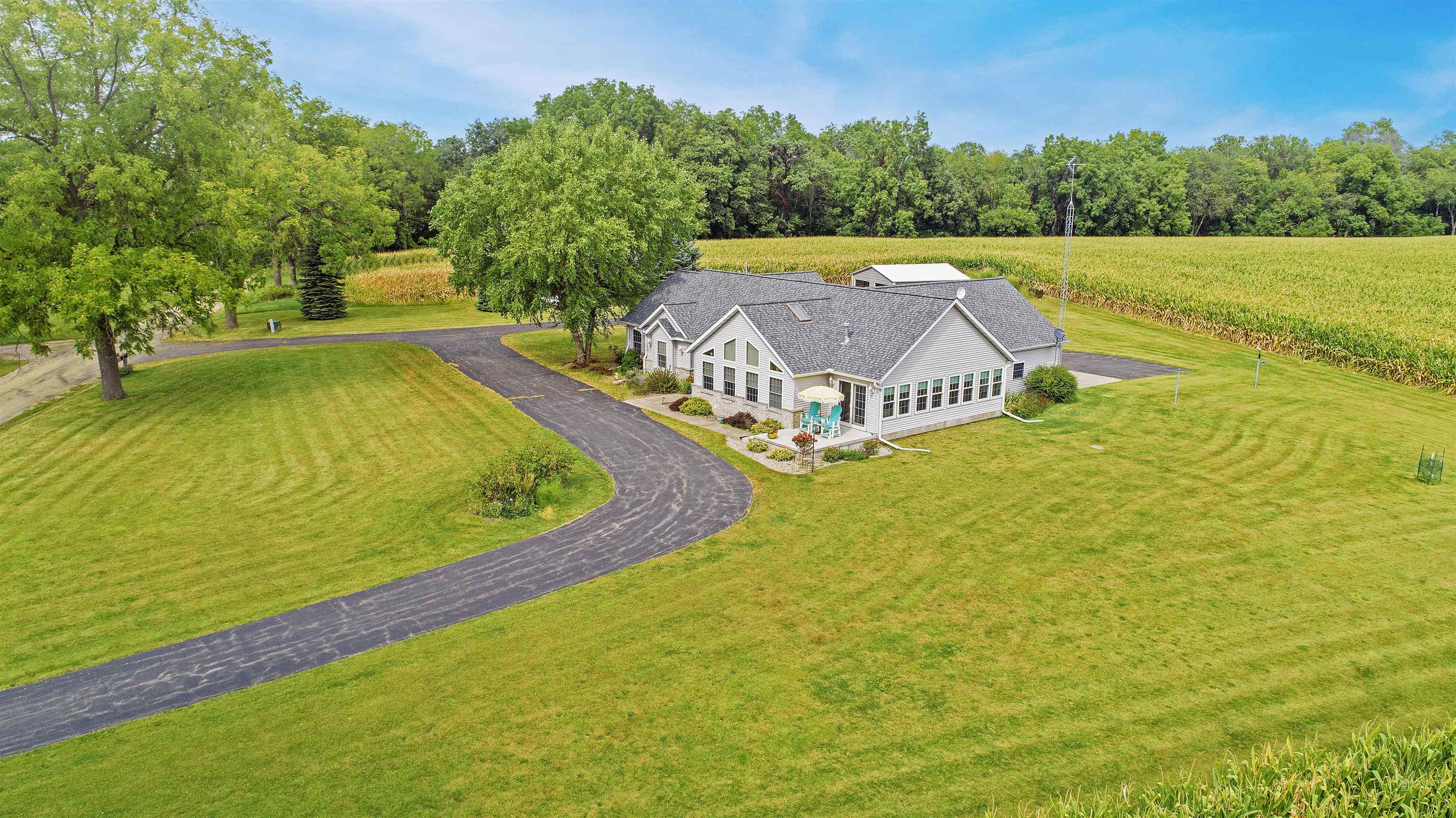 7821 Oakville Road Mount Carroll, IL 61053 - Photo 42 of 50 a view of a swimming pool with an outdoor space and seating area