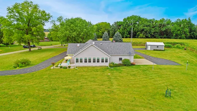 a view of swimming pool with sitting area