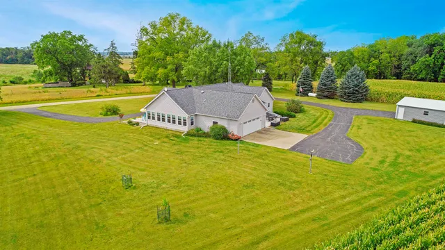 a view of house with backyard and garden