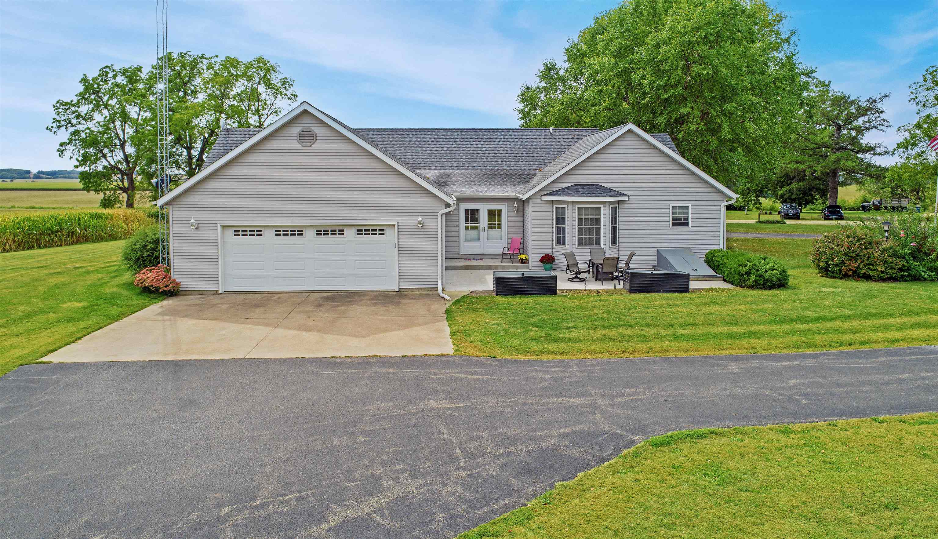 7821 Oakville Road Mount Carroll, IL 61053 - Photo 49 of 50 a view of a house with a yard and potted plants