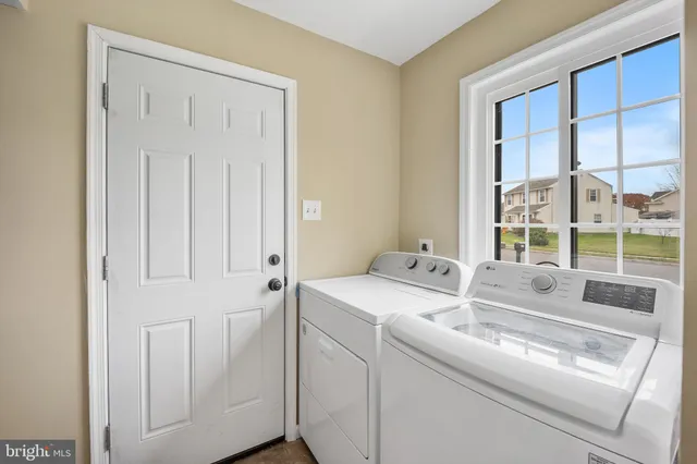 a utility room with dryer and washer