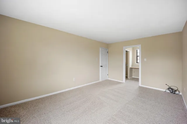 a view of a bathroom with a sink and a mirror