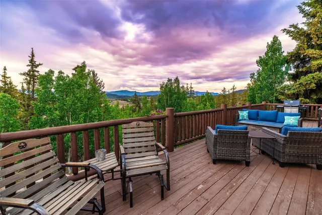 a view of balcony with wooden floor and outdoor seating